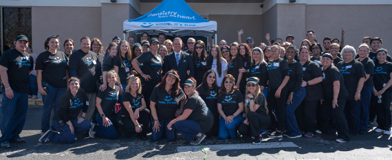 Here's an alt tag for the image: `Smiling group at Meritsy Heart event` Here's an alt tag for the image: `Smiling group at Meritsy Heart event`